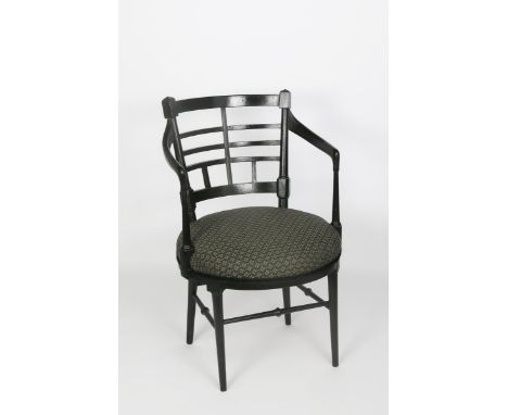 An Aesthetic Movement ebonised wood Jacobean armchair designed by Edward William Godwin,  circular padded seat on tapering, t