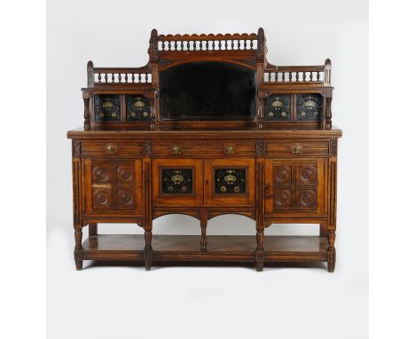 A large Aesthetic Movement sideboard/buffet the design attributed to Bruce Talbert,  rectangular, with central two door cupbo