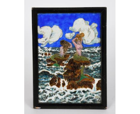 Mermaids a Limoges enamel plaque,  rectangular enamelled with two mermaid resting on rocks above sea waves, in ebonised wood 