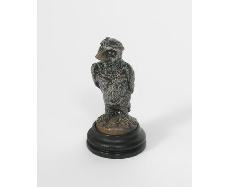 A miniature Martin Brothers stoneware bird by Robert Wallace Martin, dated 1914, modelled standing and casting a slight uprai