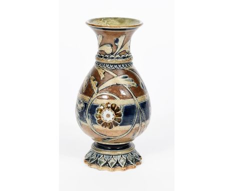 An early Martin Brothers stoneware vase by Robert Wallace Martin, ovoid with flaring rim, on carved foliage foot,  incised wi