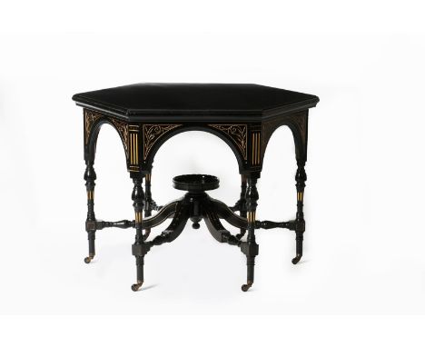 An Aesthetic Movement ebonised wood table, hexagonal section, with small circular shelf supported on radiating stretchers, th