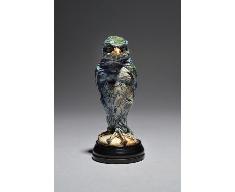 A Martin Brothers stoneware bird jar and cover by Robert Wallace Martin,  dated 1913, modelled standing erect and casting a s