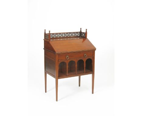 A Liberty &amp; Co Anglo Moorish mahogany bureau,  fall front fitted bureau over long single drawer, over arched shelf, on ta