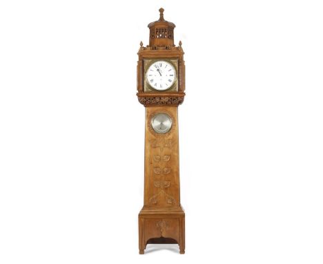 A fine walnut long case clock the design attributed to the Guild of Handicraft to a design by Charles Robert Ashbee,  the clo