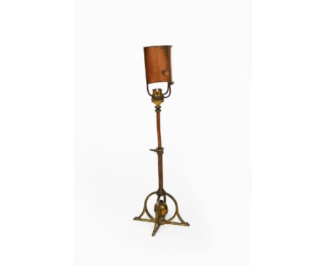 A Birmingham Guild of Handicraft copper and brass table lamp,  the extendable cylindrical stem on four square cruciform base,