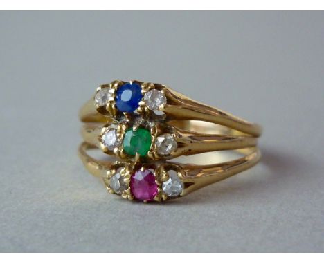 A late Victorian diamond, sapphire, emerald and ruby dress ring, in a triple band arrangement with each face being claw set w