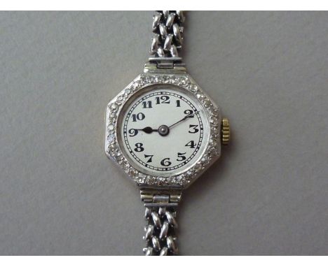 An early 20th Century lady's diamond cocktail watch, with Swiss made manual wind movement, in an 18ct gold case with white me