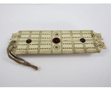 A Napoleonic prisoner of war bone cribbage board, 13 x 4 cm 