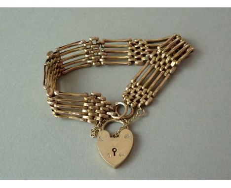 A 9ct gold gate-link bracelet with padlock clasp, 12.3g