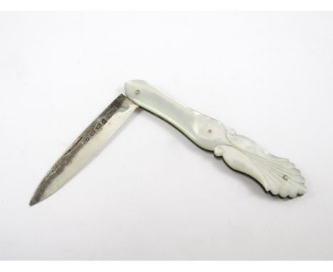 A Victorian silver folding fruit knife, with carved mother of pearl grip scales, Birmingham, 1862