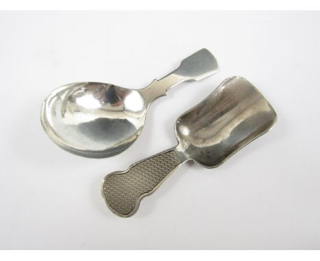 Two Georgian silver caddy spoons, one with engine turned decoration to the handle, Birmingham, 1920, and Birmingham, 1835, 23