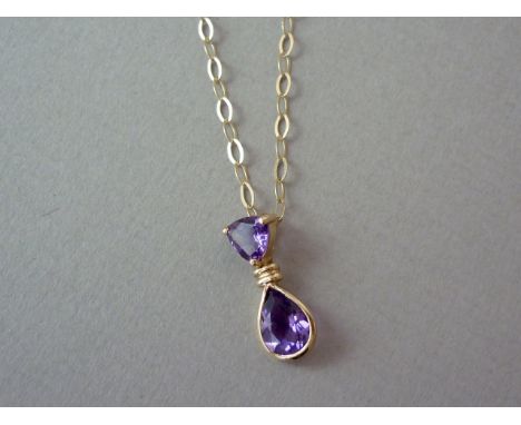 An amethyst pendant necklace, with a pear-shaped faceted stone of approximately 0.65mm, bezel set in 9ct gold and dependent b