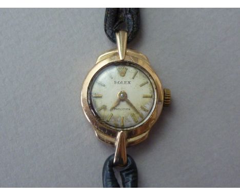 A lady's 1959 dated 9ct gold cased Rolex Precision wristwatch, with 17 jewel manual wind movement, circular silvered face wit