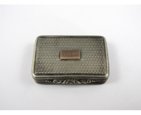 A Georgian silver vinaigrette, of rounded rectangular section with engine turned decoration to the covers, and central cartou