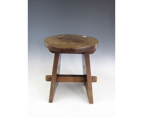 An early 20th Century Arts and Crafts hardwood stool, 36 cm 