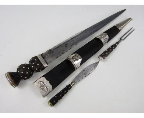 An early 19th Century Scottish white metal mounted dirk, the blade stamped Macleod, 2 College St, Edin**, the scabbard mounts