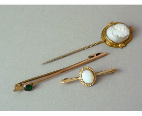 Two 9ct gold bar brooches, one set with an opal cabochon within a rope twist frame, together with a rolled gold cameo stick p