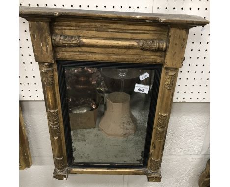 A 19th Century giltwood and gesso framed pier glass, the moulded cornice over a acanthus capped column decorated frame enclos