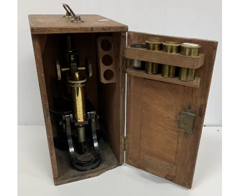 A circa 1900 lacquered brass and black lacquered monocular microscope by J Swift & Son of London, approx. 29 cm high in mahog