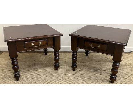 A pair of modern mahogany lamp tables in the Victorian taste, the tops with moulded edge over a single frieze drawer, with br