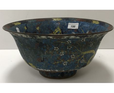 A 19th Century Chinese cloisonné bowl decorated with the horses of Mu Wang on a turquoise ground with central medallion of a 