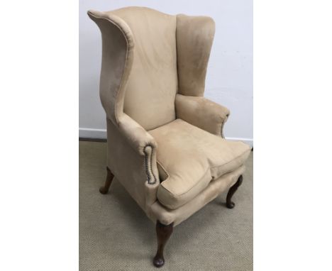 An 18th Century and later pale brown suede leather upholstered swing back scroll arm chair on cabriole legs to pad feet (Prov