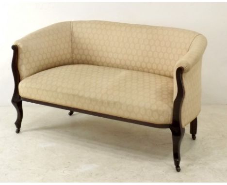 A Victorian two seater settee upholstered in peach silk cotton fabric, with serpentine legs, terminating in ceramic castors, 