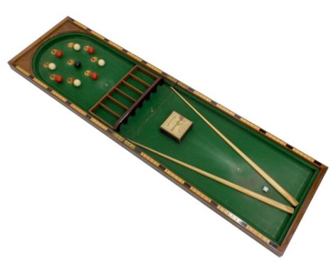 An early 20th century mahogany cased table bagatelle, by E. J. Riley Limited, Accrington, with two cues, box of 'Crystalate' 