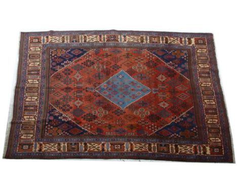 A Meimeh carpet, a light blue central stepped diamond on red ground with dark blue spandrels with allover filler elements, 31