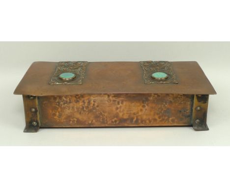 An Arts & Crafts copper box with embossed strap work hinges set with high fired Ruskin type turquoise ceramic roundels, 22 by
