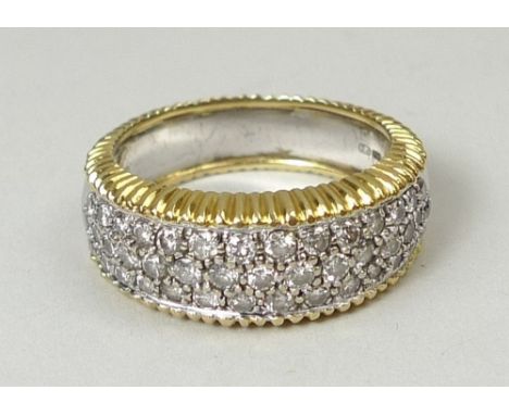 An 18ct white and yellow gold ring pave set with forty three brilliant cut diamonds, approximately 1ct, size R, 10.1g.