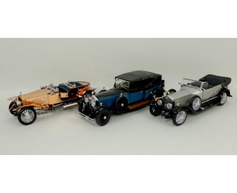 A Franklin Mint model, scale 1:24, of a Rolls Royce 1925 Silver Ghost, another of a 1919 Phantom 1, and a third of a 1921 cop