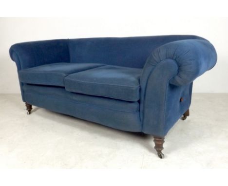 An early Edwardian sofa with turned legs and faux drop end, re-upholstered in blue velour, 182 by 92 by 78cm high.