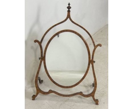 An Edwardian satinwood skeleton frame toilet mirror, with oval plate and turned finial, 52 by 24 by 68cm high.