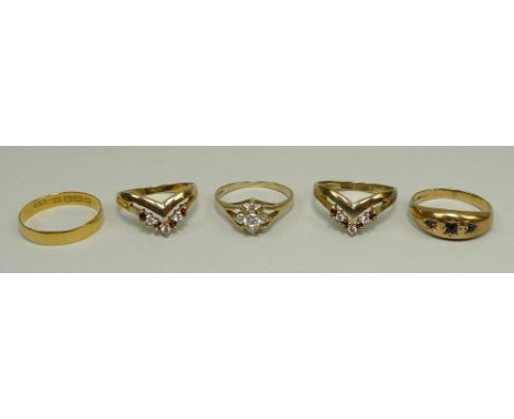 A 22ct gold wedding band, 1.4g, size L, a 9ct gold ring set with five crystals, size K, a 9ct gold ring with three graduated 