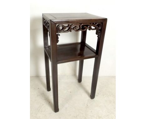 A Chinese hardwood square two tier jardiniere stand with leaf scroll decoration, 42 by 31 by 80cm high.