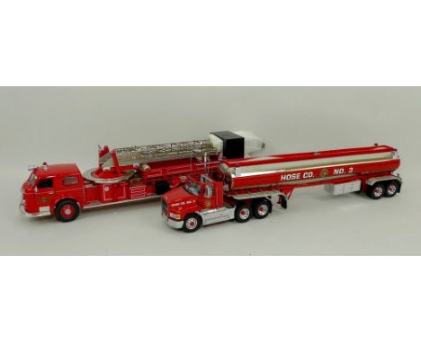 A Franklin Mint model, scale 1:43, of an Ultimate Mack Firefighting Tanker, and another, scale 1:32,of a 1954 American LA Fra