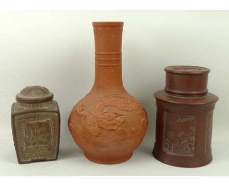 A Chinese Yixing pottery tea caddy of cylindrical form with inscribed characters, 17cm high, a slab sided tea caddy with pipe