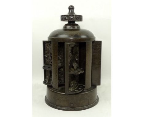 A 20th century Japanese bronze pipe or cigar stand, with rotating top cast with the twelve animals of the zodiac, turning to 