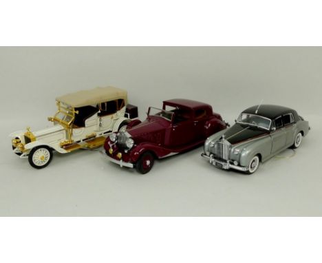 A Franklin Mint model, scale 1:24, of a Rolls Royce 1955 Silver Cloud, another of a 1911 Tourer, and a Danbury Mint model of 