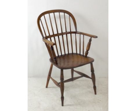 A Windsor ash and elm chair, with low stick back, with H stretcher, 94cm high. 