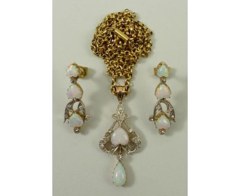 An opal and diamond suite comprising a pendant on chain and a pair of earrings, the pendant set with a central heart shaped o