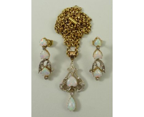 An opal and diamond suite comprising a pendant on chain and a pair of earrings, the pendant set with a central heart shaped o