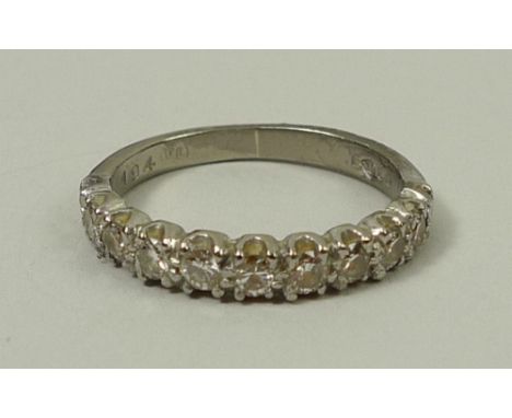 An 18ct white gold and diamond half hoop eternity ring, approximately 0.4ct, size I, 2.8g.