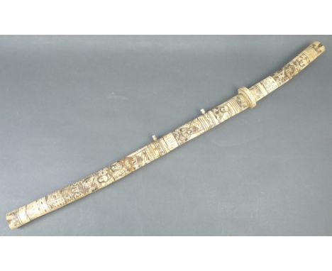 A late 19th century Japanese short sword with bone scabbard carved with figures, blade length 39cm, total 76cm. 