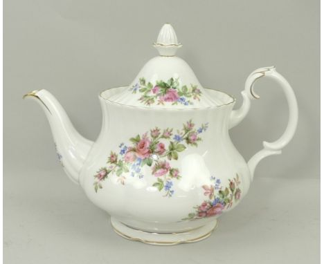 A Royal Albert tea service, in the Moss Rose pattern, comprising two tea pots (one lacking lid), three sugar bowls, two milk 