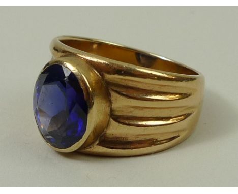 A USAF 10ct gold ring set with a synthetic sapphire, size T/U, 10.5g.