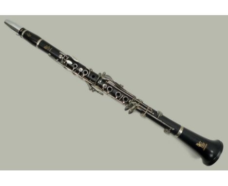 A Boosey and Hawkes wooden clarinet in A, number 3100805, with pads, complete with fitted case for two clarinets.