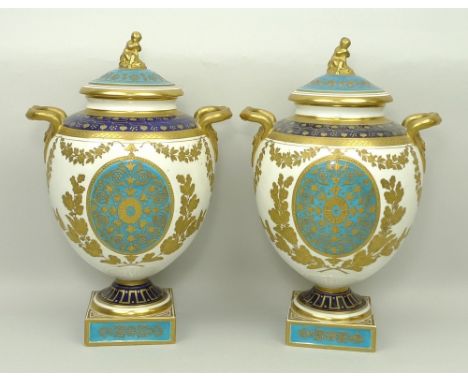 A pair of Wedgwood porcelain vases and covers, late 19th century, of twin handled baluster form, the lid with figural finial,